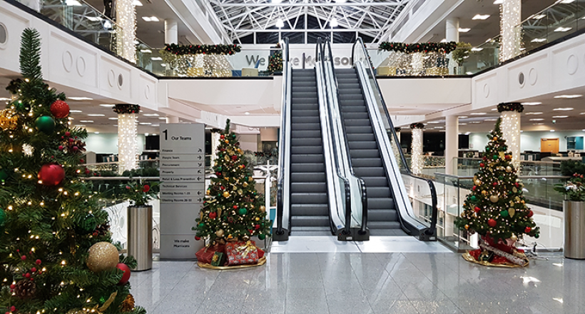 An office decorated for Christmas.