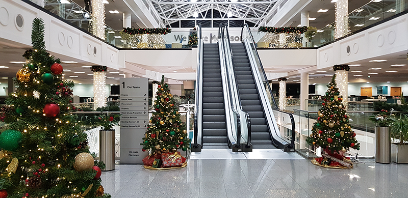 An office decorated for Christmas.