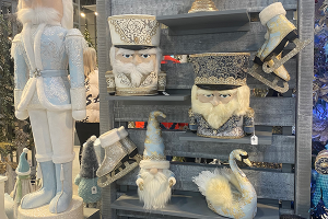 Nutcrackers, Ice Skates and Swans displayed on a rustic wooden shelf.