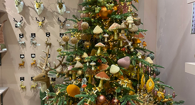 3 A christmas tree filled with woodland style decorations such as mushrooms and flowers in rustic colours.